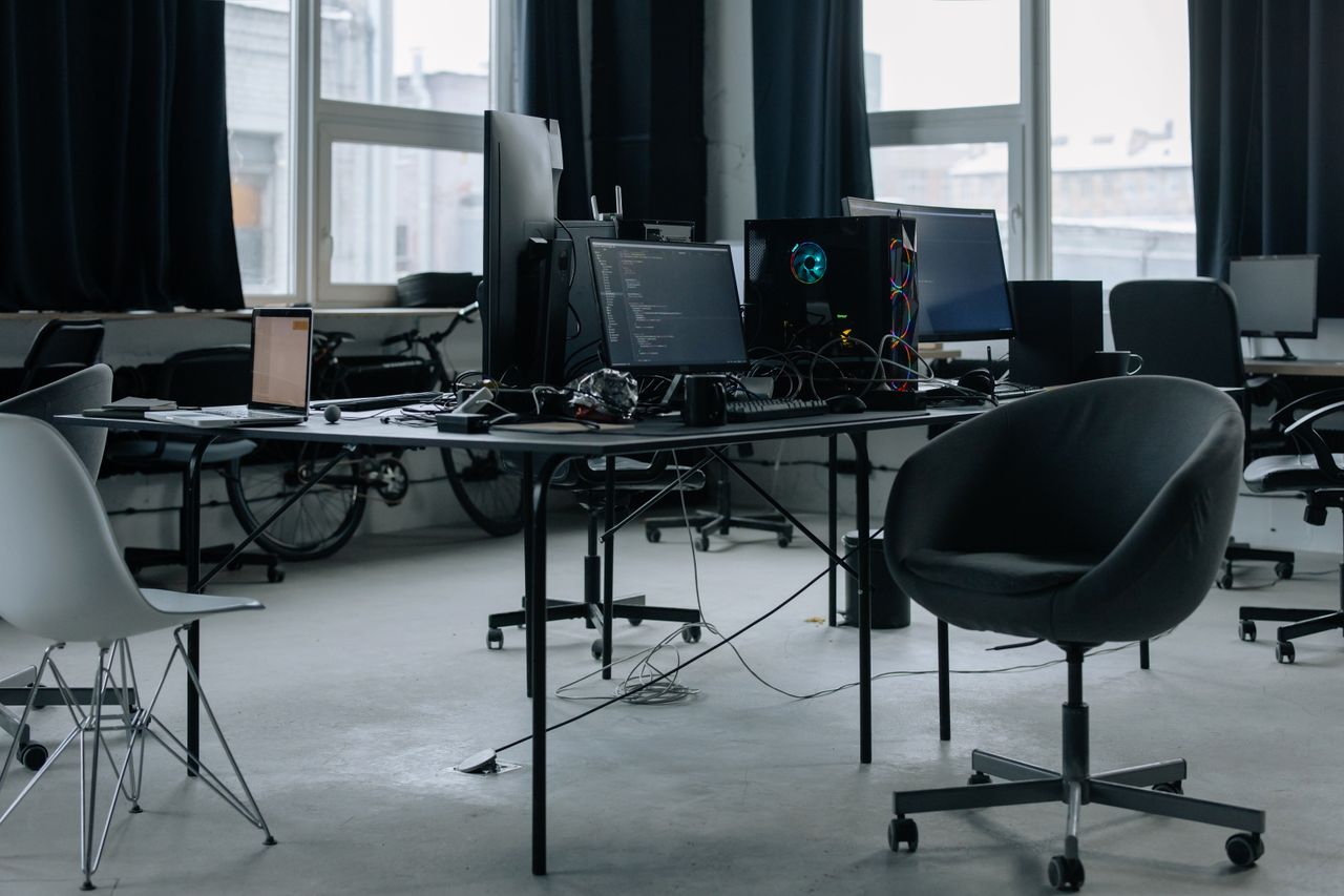 Crafting Captivating Headlines: Your awesome post title goes here Discover a modern office workspace with computers, chairs, and natural light from large windows.